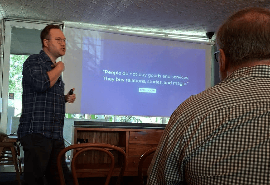 Simon Grainger pitch presentation in action at business pitching workshop showing storytelling and persuasion principles, quote from Seth Godin.