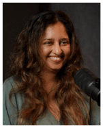 Dr Nerisha Maharaj smiling during her feature on The Incredible Machines podcast, speaking into a professional podcast microphone. Her episode explores women's voices in leadership, self-love, and spiritual intelligence in purpose-driven entrepreneurship.