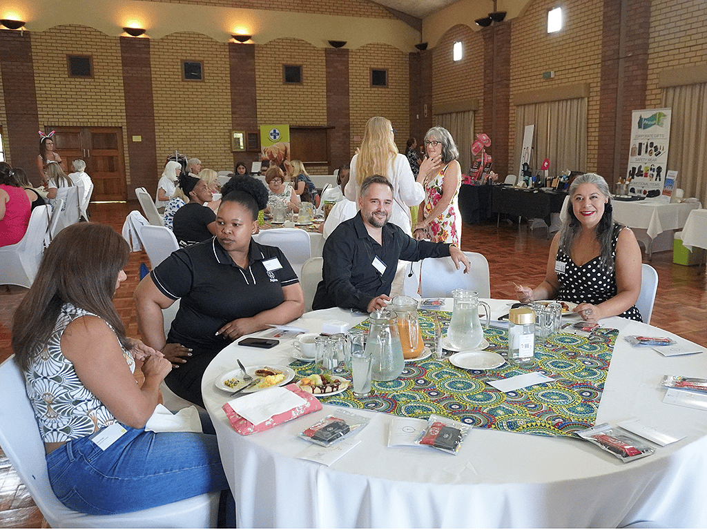 Jonathan Oliff networking with attendees at KZN Women in Business event discussing finding your 3 things and personal growth, photography by Janelle Vernall