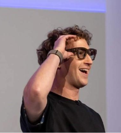 Mark Zuckerberg demonstrates Meta smart glasses at a press event, symbolising the company's shift towards personal superintelligence and AI-enhanced wearables.