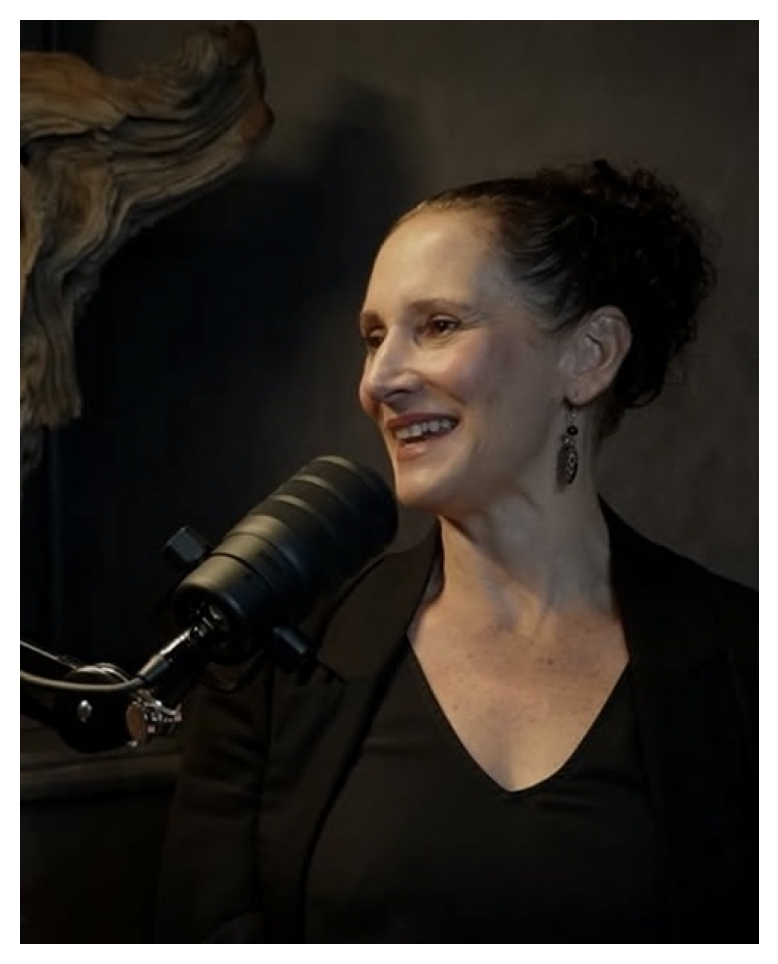 Debra Clelland, dressed in black and smiling, speaks on The Incredible Machines podcast. Her conversation covers empathy, inclusive leadership, and advocacy rooted in lived experience – spotlighting the impact of women in systemic change.