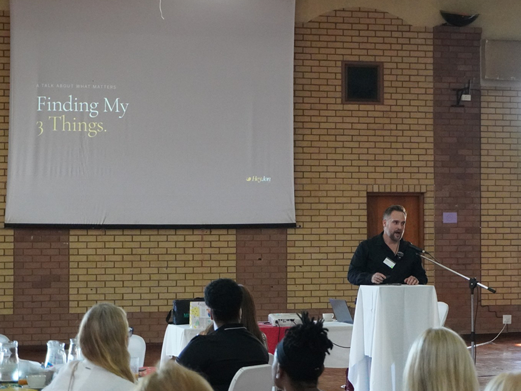 Jon Oliff presenting finding your 3 things framework on stage at KZN Women in Business event in Durban North