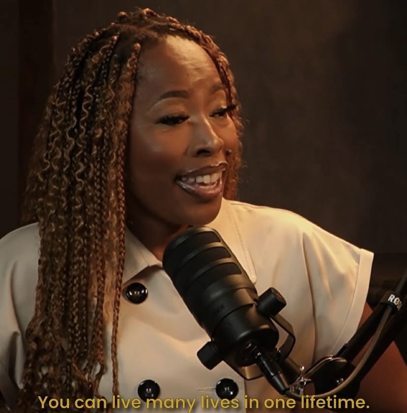 Mpume Zwane Langa in the Tim podcast studio, captured in a bold moment from Episode 24. Her quote “You can live many lives in one lifetime” appears onscreen, embodying her message of reinvention, identity, and freedom in business and life. She speaks with enthusiasm, styled in a cream-toned outfit and seated at the signature Tim mic.