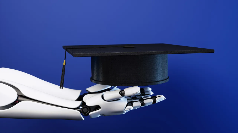 A robotic arm holding a graduation cap, symbolising AI competency as a graduation requirement