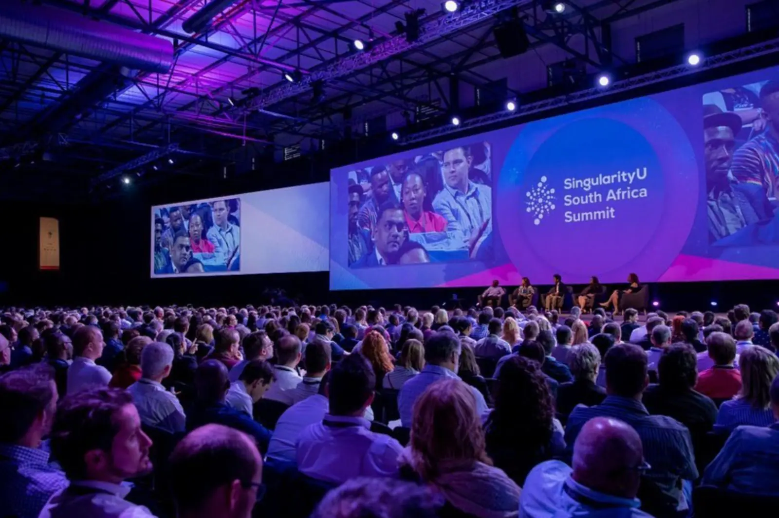 A packed hall watching a panel at the SingularityU South Africa Summit